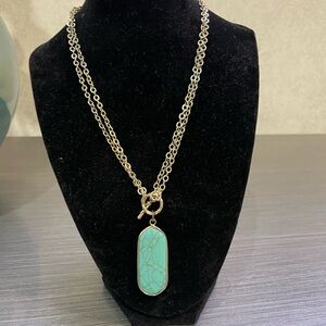 Bezel turquoise stone necklace on gold. Toggle closing